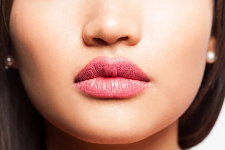 Close up view of a lady with full and luscious lips.