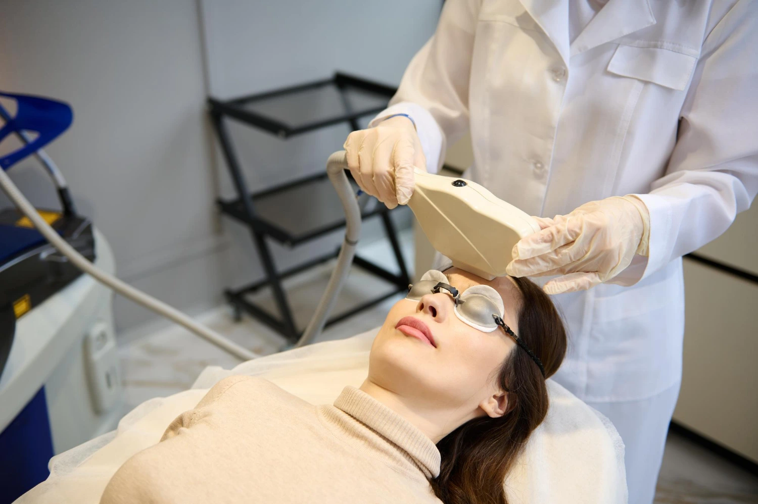A lady undergoing Pigment Laser Treatment at clinic.